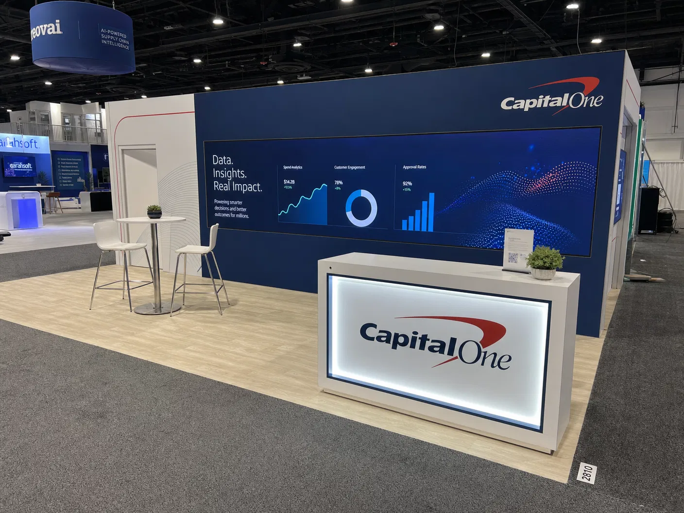 10' x 30' inline LED trade show exhibit category hero featuring an executive-style banking and finance exhibit with contained hover media